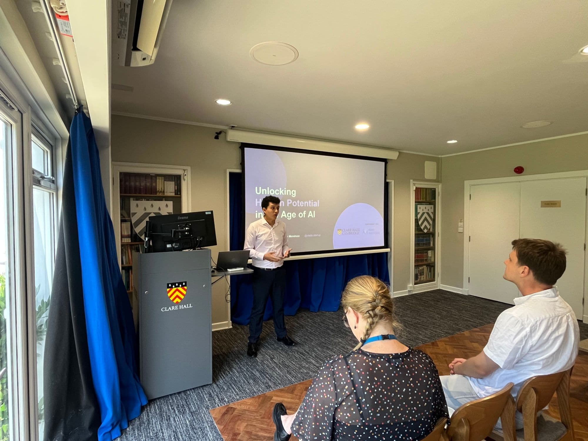 Vladimir Guzmán presenting at Clare Hall, Cambridge